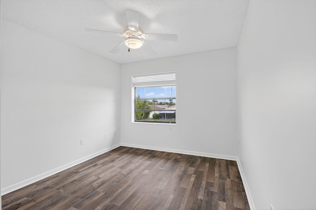 5235 Europa Dr Unit K, Boynton Beach, FL 33437 - empty room with dark wood finished floors, ceiling fan, and a textured ceiling