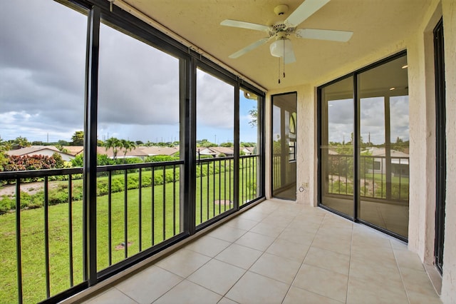 5235 Europa Dr Unit K, Boynton Beach, FL 33437 - unfurnished sunroom featuring a ceiling fan