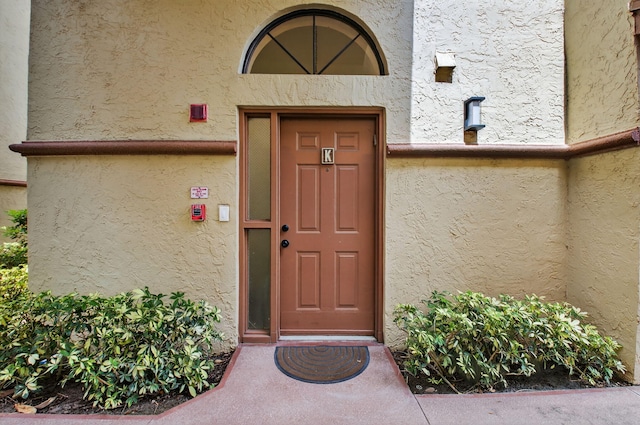 5235 Europa Dr Unit K, Boynton Beach, FL 33437 - property entrance featuring stucco siding