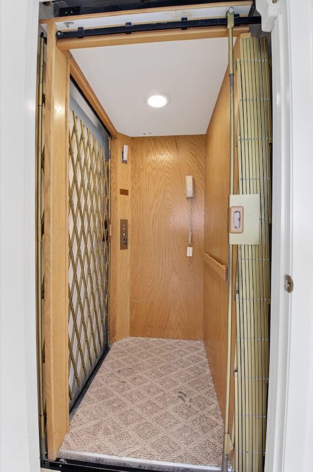 5235 Europa Dr Unit K, Boynton Beach, FL 33437 - elevator featuring wooden walls
