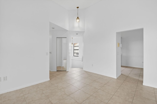 5235 Europa Dr Unit K, Boynton Beach, FL 33437 - spare room with a high ceiling and light tile patterned floors