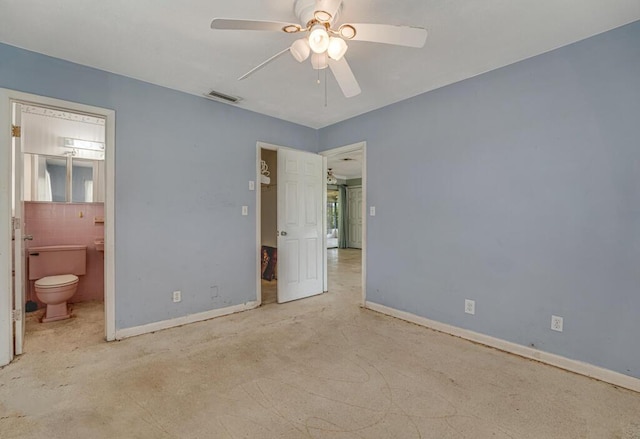 4840 Pineaire Ln, West Palm Beach, FL 33417 - unfurnished bedroom featuring ensuite bath and ceiling fan