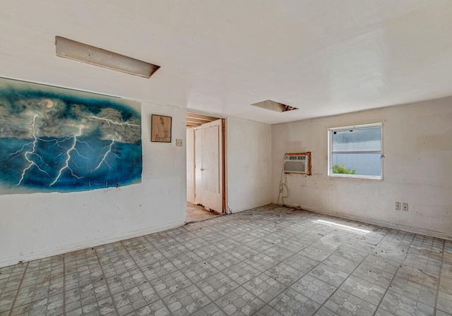 4840 Pineaire Ln, West Palm Beach, FL 33417 - spare room with a wall mounted air conditioner and tile patterned floors