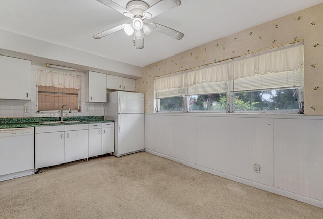 4840 Pineaire Ln, West Palm Beach, FL 33417 - kitchen featuring white appliances, white cabinetry, dark countertops, a ceiling fan, and wallpapered walls