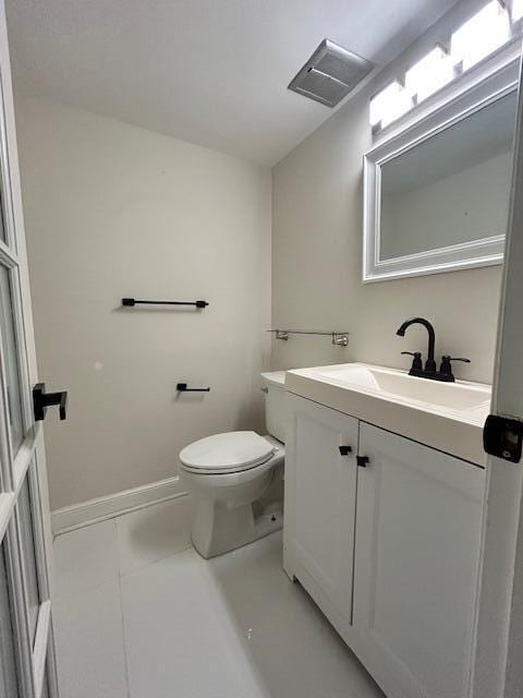 808 SE 7th St Unit 107, Deerfield Beach, FL 33441 - half bathroom with vanity and tile patterned flooring