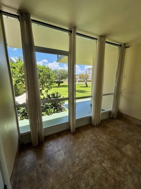 808 SE 7th St Unit 107, Deerfield Beach, FL 33441 - entryway with healthy amount of natural light