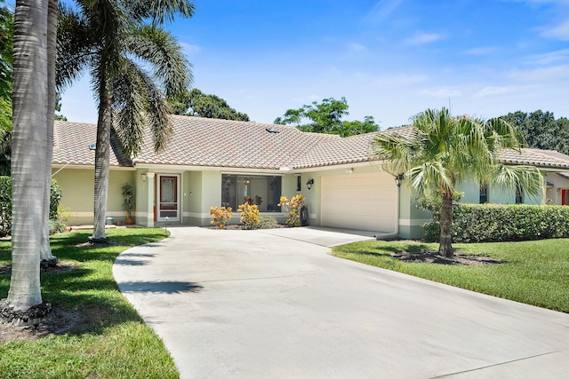 3003 SW Seaboard Ave, Palm City, FL 34990 - ranch-style house featuring stucco siding, a tile roof, driveway, and a garage