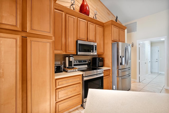 3003 SW Seaboard Ave, Palm City, FL 34990 - kitchen featuring appliances with stainless steel finishes, light countertops, and vaulted ceiling