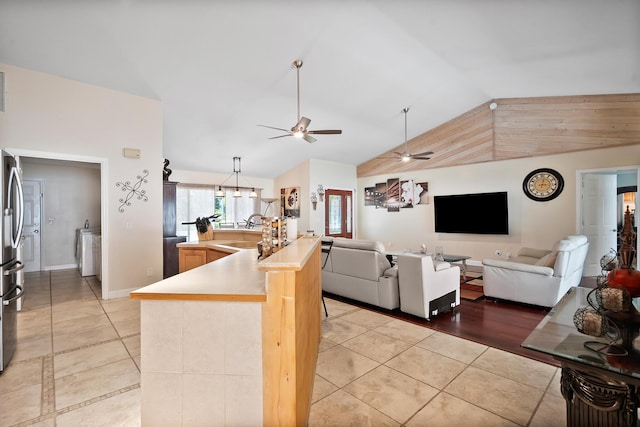 3003 SW Seaboard Ave, Palm City, FL 34990 - living area featuring a ceiling fan, light tile patterned floors, and high vaulted ceiling