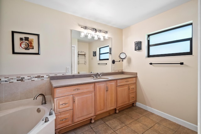 3003 SW Seaboard Ave, Palm City, FL 34990 - bathroom with vanity, a garden tub, and tile patterned floors