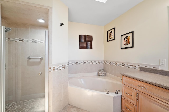 3003 SW Seaboard Ave, Palm City, FL 34990 - full bath with a bath, a stall shower, vanity, tile patterned floors, and tile walls