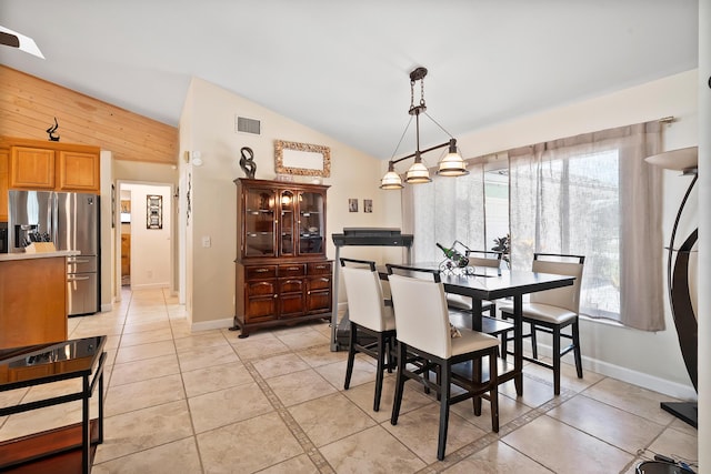 3003 SW Seaboard Ave, Palm City, FL 34990 - dining room with vaulted ceiling and light tile patterned flooring