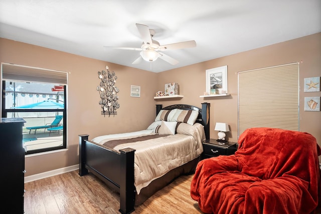 3003 SW Seaboard Ave, Palm City, FL 34990 - bedroom featuring light wood-style flooring and a ceiling fan