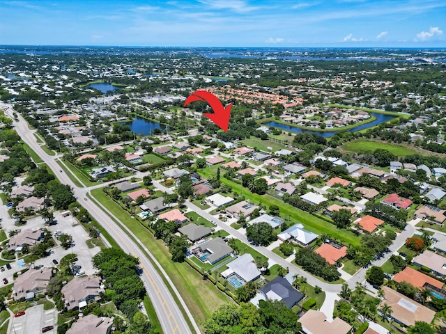 3003 SW Seaboard Ave, Palm City, FL 34990 - aerial view of property and surrounding area featuring a nearby body of water and nearby suburban area