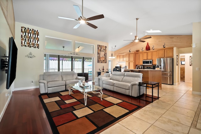 3003 SW Seaboard Ave, Palm City, FL 34990 - living area featuring ceiling fan, high vaulted ceiling, and a skylight