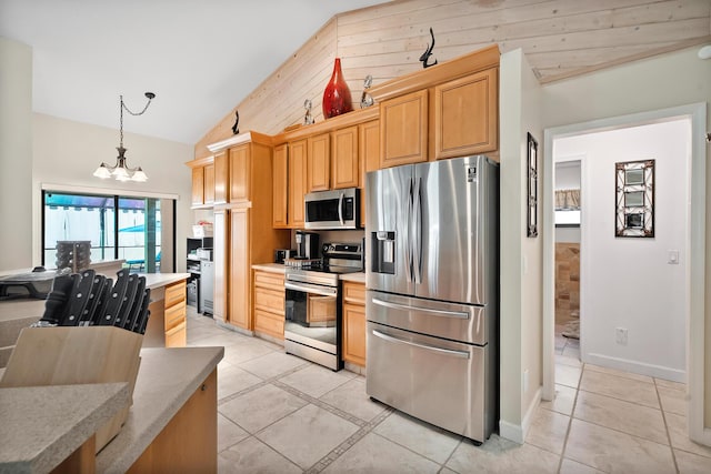3003 SW Seaboard Ave, Palm City, FL 34990 - kitchen featuring appliances with stainless steel finishes, a chandelier, light tile patterned floors, hanging light fixtures, and light countertops