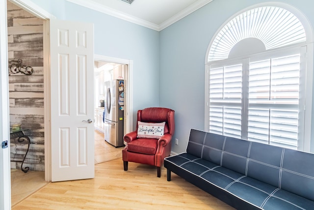 11355 SW Rockingham Dr, Port Saint Lucie, FL 34987 - living area with light wood-style flooring and crown molding