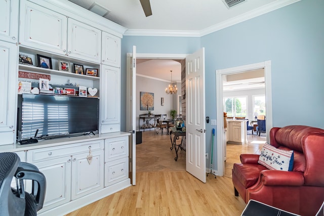 11355 SW Rockingham Dr, Port Saint Lucie, FL 34987 - living room with ornamental molding, a chandelier, ceiling fan, and light wood-style flooring
