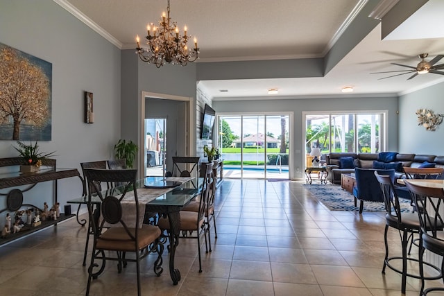 11355 SW Rockingham Dr, Port Saint Lucie, FL 34987 - tiled dining area featuring crown molding, a chandelier, and a ceiling fan