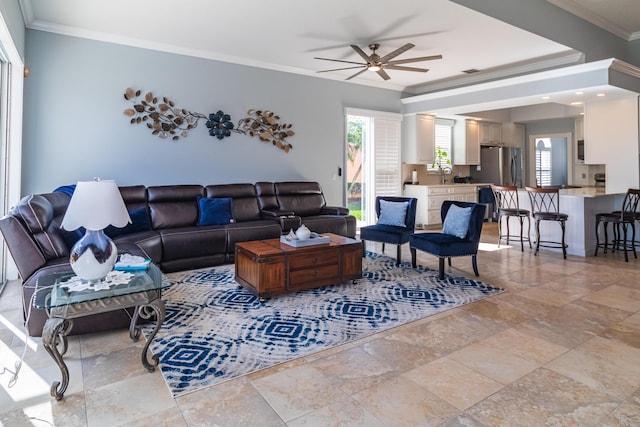 11355 SW Rockingham Dr, Port Saint Lucie, FL 34987 - living room featuring ceiling fan, ornamental molding, and stone tile flooring