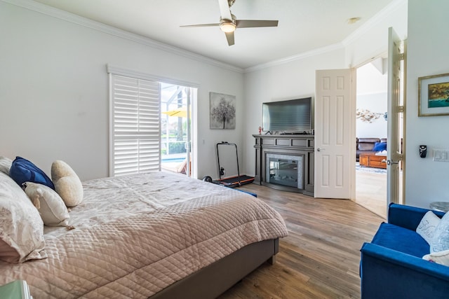 11355 SW Rockingham Dr, Port Saint Lucie, FL 34987 - bedroom featuring ornamental molding, wood finished floors, access to outside, and ceiling fan