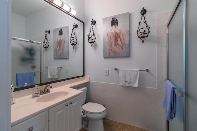 11355 SW Rockingham Dr, Port Saint Lucie, FL 34987 - full bath featuring a shower stall, vanity, tile walls, and wainscoting