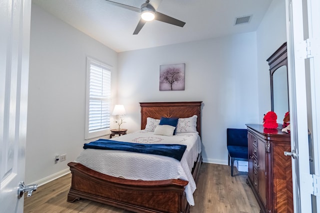 11355 SW Rockingham Dr, Port Saint Lucie, FL 34987 - bedroom with wood finished floors and ceiling fan