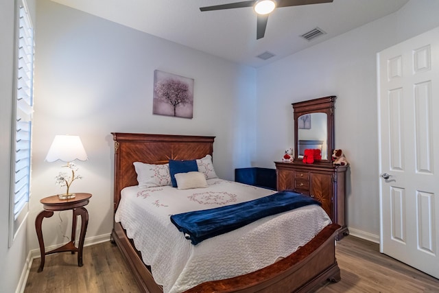 11355 SW Rockingham Dr, Port Saint Lucie, FL 34987 - bedroom with wood finished floors and a ceiling fan