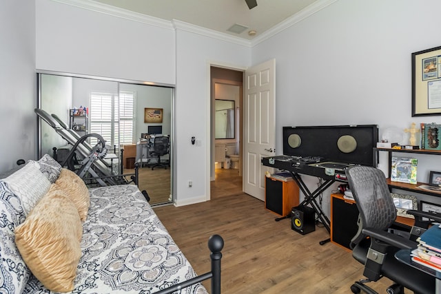 11355 SW Rockingham Dr, Port Saint Lucie, FL 34987 - bedroom with crown molding, a desk, wood finished floors, and a closet