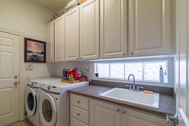 11355 SW Rockingham Dr, Port Saint Lucie, FL 34987 - laundry room featuring washer and clothes dryer and cabinet space