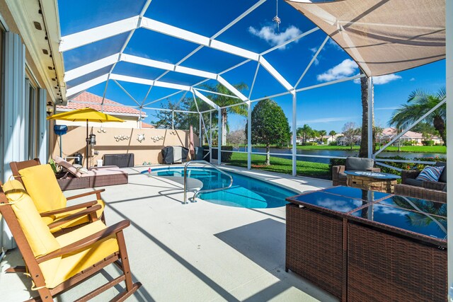 11355 SW Rockingham Dr, Port Saint Lucie, FL 34987 - view of pool featuring a patio, a water view, a lanai, and an outdoor hangout area