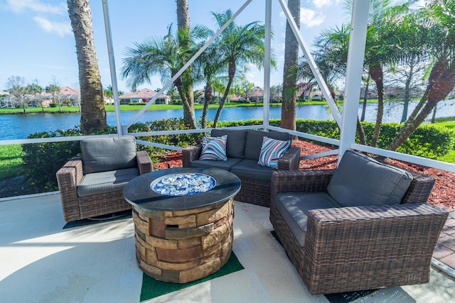 11355 SW Rockingham Dr, Port Saint Lucie, FL 34987 - view of patio / terrace with a water view and an outdoor living space with a fire pit
