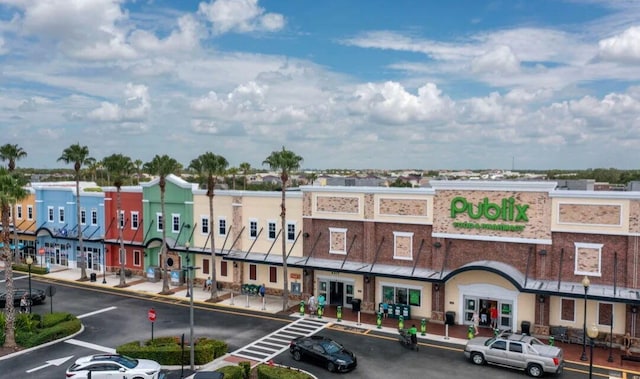 11355 SW Rockingham Dr, Port Saint Lucie, FL 34987 - view of building exterior featuring uncovered parking