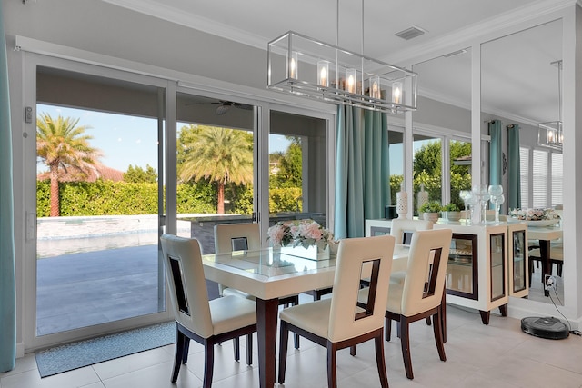 1120 Wandering Willow Way, Loxahatchee, FL 33470 - dining space featuring crown molding, a chandelier, light tile patterned flooring, and ceiling fan
