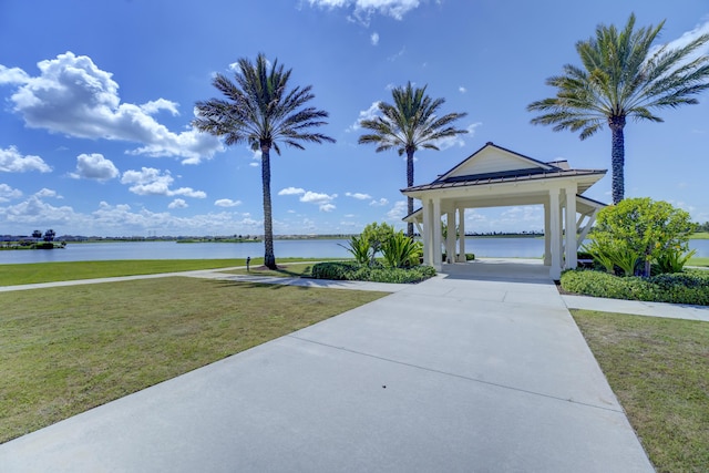 1120 Wandering Willow Way, Loxahatchee, FL 33470 - surrounding community featuring a lawn and a water view