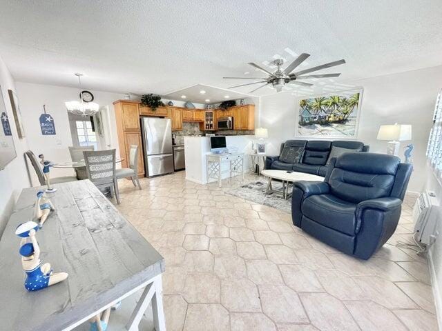 188 Upminster I Unit 188, Deerfield Beach, FL 33442 - living room with a ceiling fan, a textured ceiling, and recessed lighting