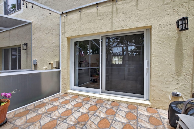 3469 Deer Creek Palladian Cir, Deerfield Beach, FL 33442 - doorway to property with stucco siding