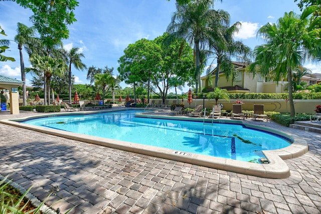 3469 Deer Creek Palladian Cir, Deerfield Beach, FL 33442 - community pool with a patio area