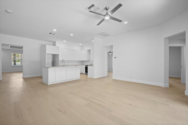 204 Clocktower Dr, Jupiter, FL 33458 - unfurnished living room with ceiling fan, light wood-type flooring, and recessed lighting