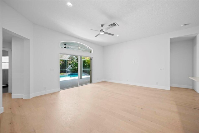 204 Clocktower Dr, Jupiter, FL 33458 - empty room featuring ceiling fan, light wood-style flooring, a textured ceiling, and recessed lighting