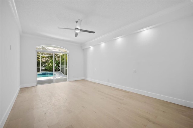 204 Clocktower Dr, Jupiter, FL 33458 - empty room with crown molding, a ceiling fan, light wood-type flooring, and a textured ceiling