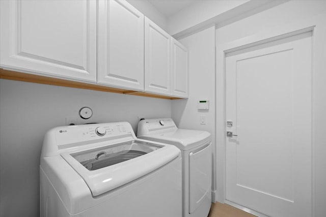 204 Clocktower Dr, Jupiter, FL 33458 - laundry room featuring separate washer and dryer and cabinet space