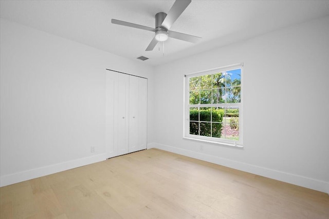 204 Clocktower Dr, Jupiter, FL 33458 - unfurnished bedroom featuring light wood finished floors, a closet, and a ceiling fan