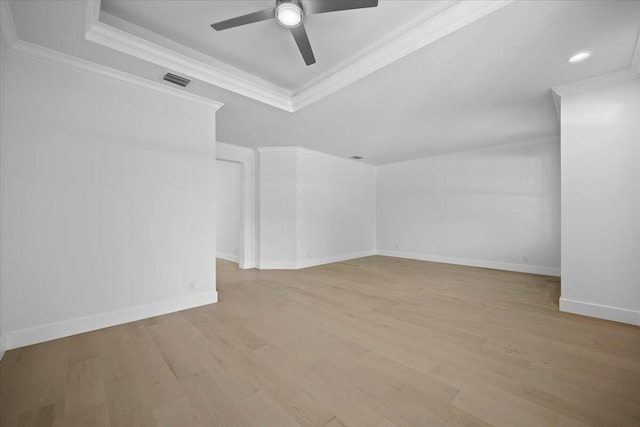 204 Clocktower Dr, Jupiter, FL 33458 - empty room featuring a ceiling fan, a raised ceiling, wood finished floors, and crown molding