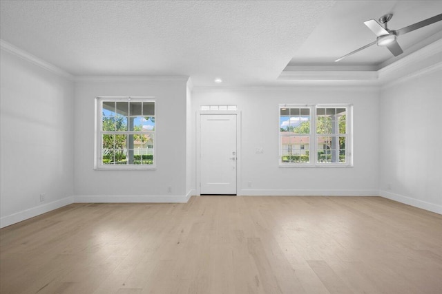 204 Clocktower Dr, Jupiter, FL 33458 - entryway featuring ornamental molding, healthy amount of natural light, light wood-type flooring, and a ceiling fan