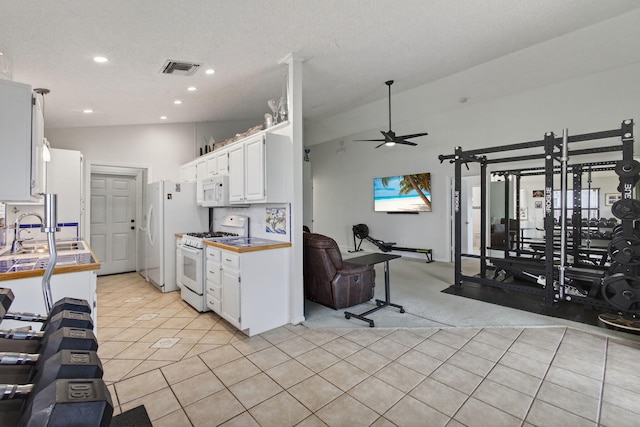6093 Lucerne St, Jupiter, FL 33458 - kitchen with white appliances, light tile patterned floors, white cabinetry, recessed lighting, and a ceiling fan