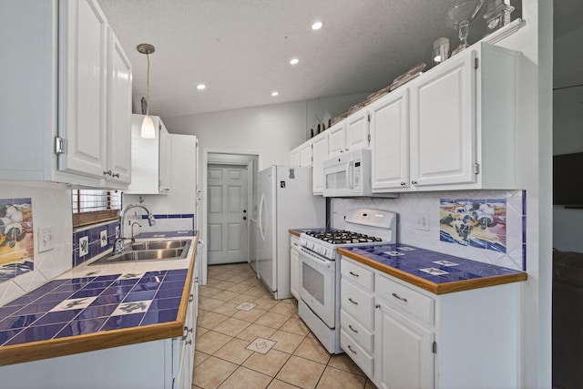 6093 Lucerne St, Jupiter, FL 33458 - kitchen featuring white appliances, tile counters, white cabinetry, recessed lighting, and tasteful backsplash