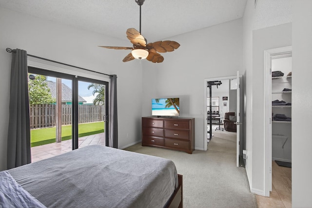 6093 Lucerne St, Jupiter, FL 33458 - bedroom featuring multiple windows, access to exterior, a spacious closet, and a ceiling fan