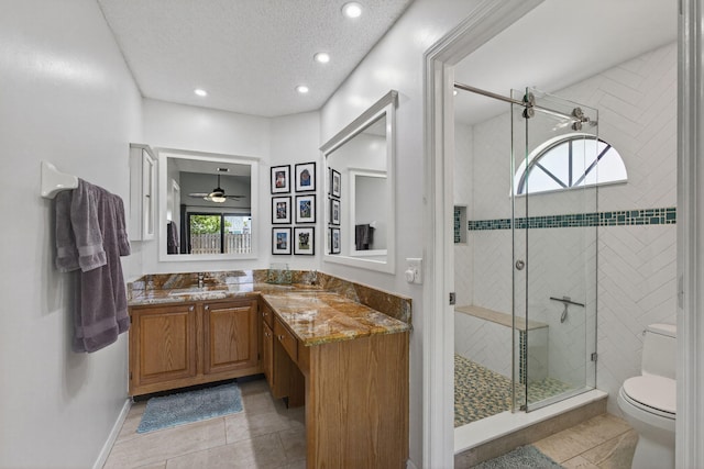 6093 Lucerne St, Jupiter, FL 33458 - full bathroom featuring plenty of natural light, vanity, a shower stall, recessed lighting, and a textured ceiling