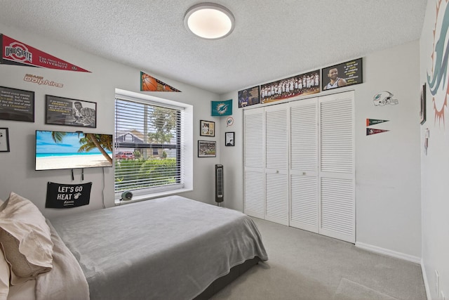 6093 Lucerne St, Jupiter, FL 33458 - bedroom featuring carpet, a textured ceiling, and a closet